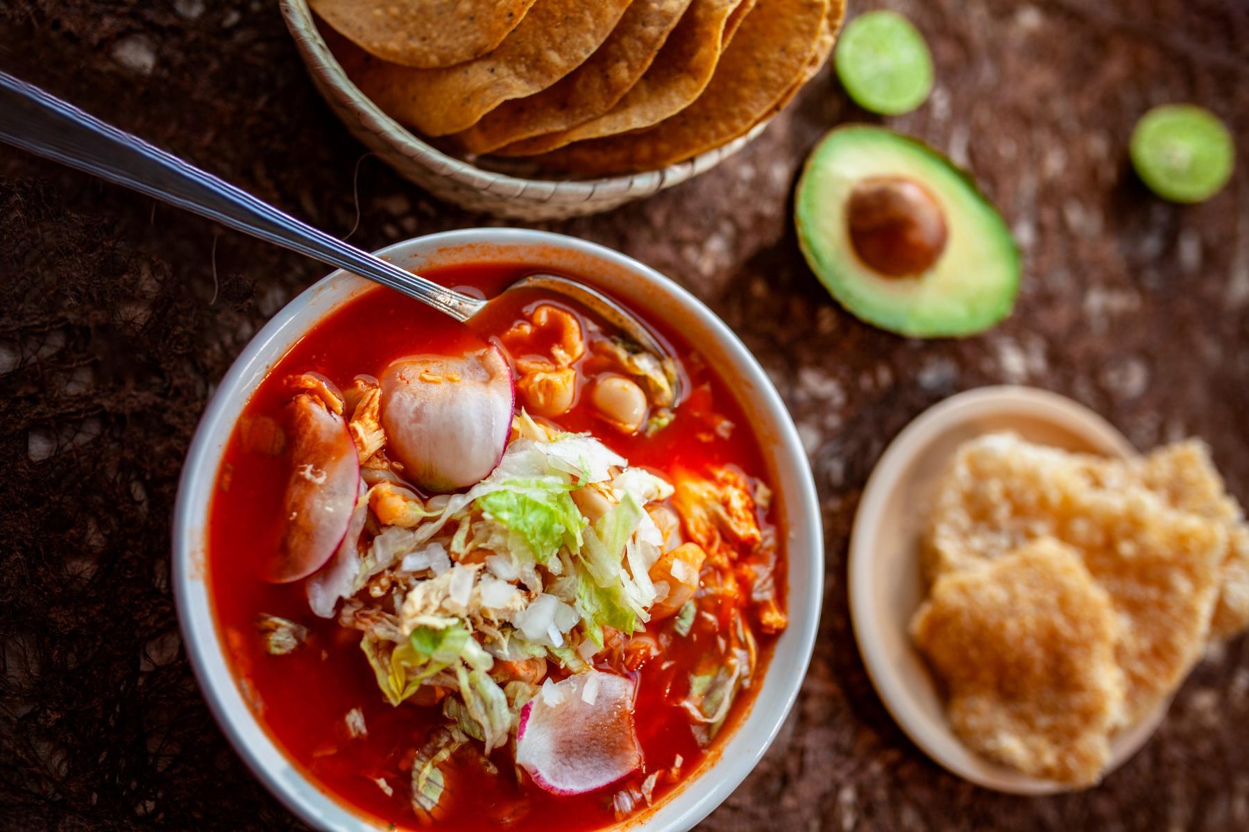 Overhead view of a bowl of posole.