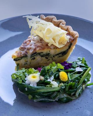 A close-up of a quiche entree