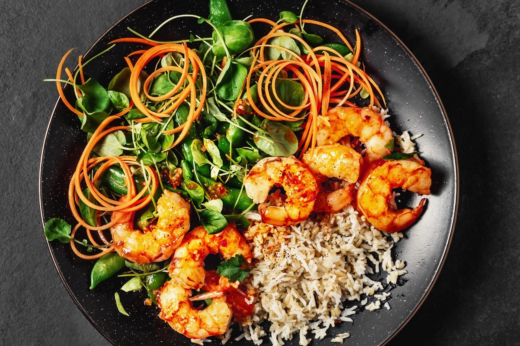 Overhead view of chopped salad with shrimp.