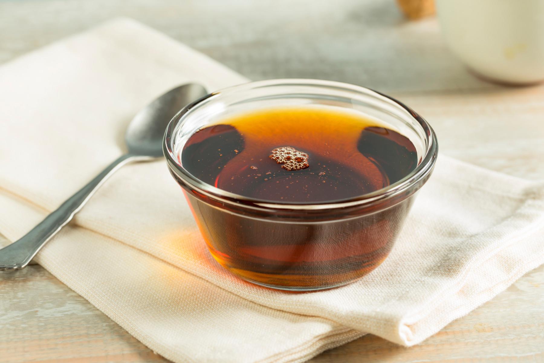 Close-up of a clear bowl of syrup.